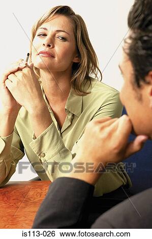 Businessman and businesswoman flirting View Large Photo Image Stock Photograph - Businessman and businesswoman flirting. Fotosearch