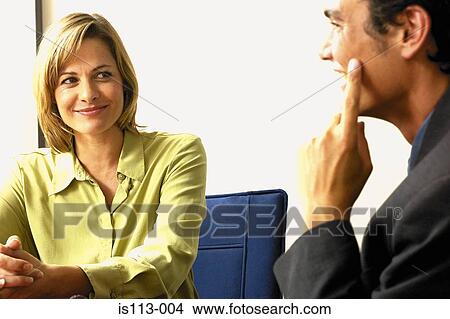 Businessman and businesswoman joking View Large Photo Image Picture - Businessman and businesswoman joking . Fotosearch