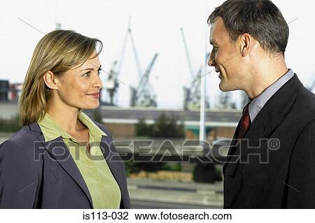 Businessman and businesswoman meeting outside View Large Photo Image Stock Image - Businessman and businesswoman meeting outside. Fotosearch