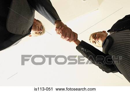 Businessmen shaking hands View Large Photo Image Stock Image - Businessmen shaking hands. Fotosearch