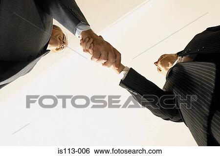 Stock Photograph - Businessmen shaking hands. Fotosearch