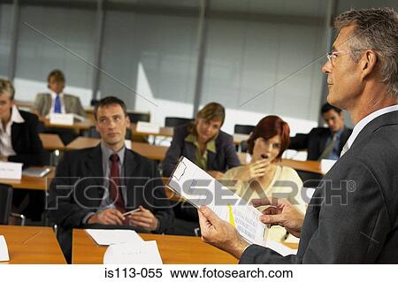 Businesspeople being lectured View Large Photo Image Stock Photography - Businesspeople being lectured. Fotosearch