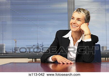 Businesswoman in office View Large Photo Image Stock Image - Businesswoman in office. Fotosearch