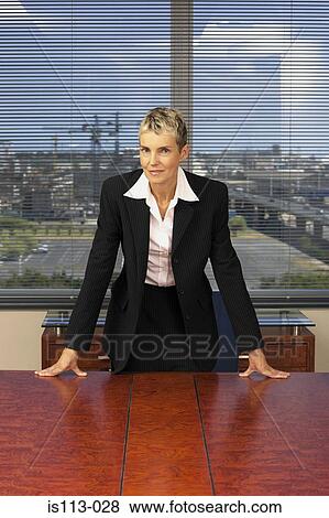 Businesswoman in office View Large Photo Image Stock Photo - Businesswoman in office. Fotosearch
