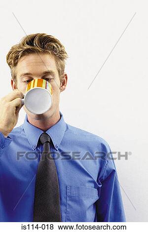 Businessman drinking a cup of tea View Large Photo Image Stock Photo - Businessman drinking a cup of tea. Fotosearch