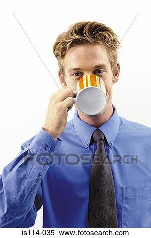Stock Photography - Businessman drinking a cup of tea. Fotosearch