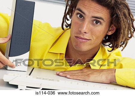 Businessman showing computer loudspeaker View Large Photo Image Stock Photograph - Businessman showing computer loudspeaker. Fotosearch