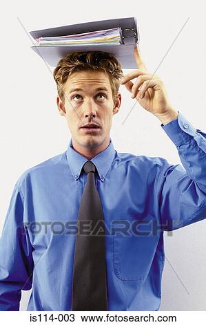 Stock Image - Businessman with file on head. Fotosearch