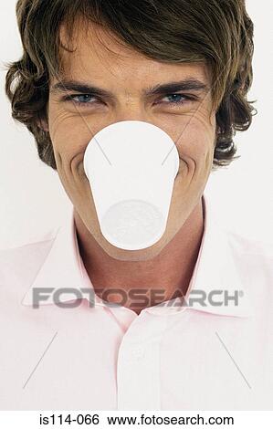Stock Photograph - Businessman with plastic cup in mouth. Fotosearch