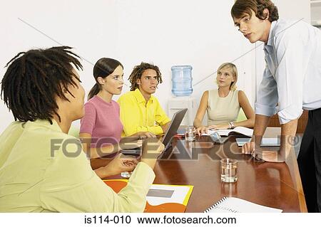 Businesspeople in meeting View Large Photo Image Stock Image - Businesspeople in meeting. Fotosearch
