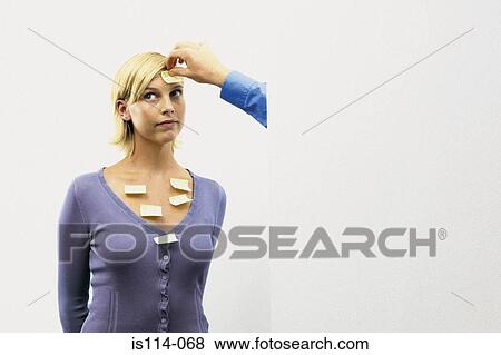 Stock Photo - Businesswoman covered in post-it slips. Fotosearch