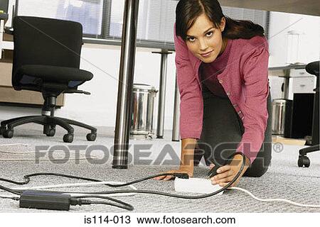 Businesswoman under table in office View Large Photo Image Stock Image - Businesswoman under table in office. Fotosearch