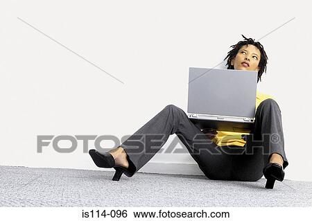 Businesswoman with laptop computer View Large Photo Image Stock Photograph - Businesswoman with laptop computer. Fotosearch