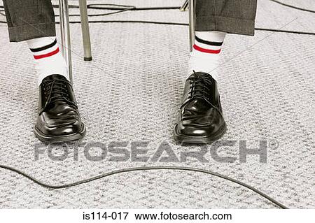 Feet dressed in white socks and black shoes View Large Photo Image Stock Photo - Feet dressed in white socks and black shoes. Fotosearch