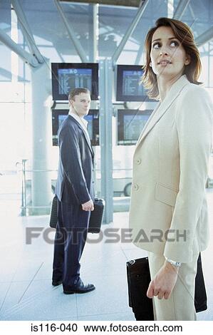 Business colleagues in airport terminal View Large Photo Image Stock Image - Business colleagues in airport terminal. Fotosearch