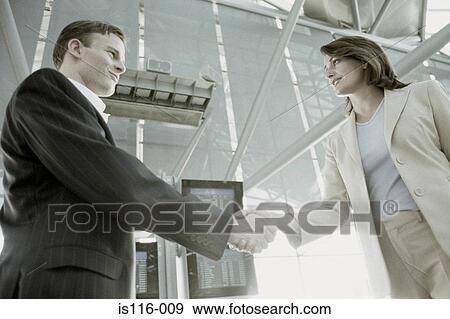Business colleagues in airport terminal View Large Photo Image Stock Photo - Business colleagues in airport terminal. Fotosearch