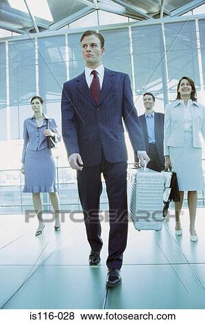 Businessman in airport terminal View Large Photo Image Stock Photo - Businessman in airport terminal. Fotosearch