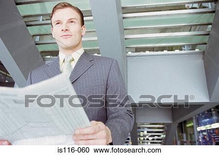 Businessman waiting in airport lounge View Large Photo Image Stock Image - Businessman waiting in airport lounge. Fotosearch