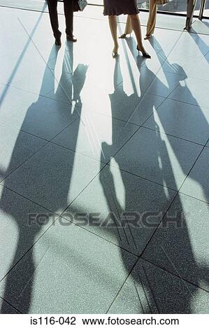 Businesspeople casting a shadow View Large Photo Image Stock Image - Businesspeople casting a shadow. Fotosearch