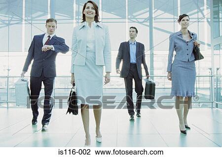 Businesspeople in airport terminal View Large Photo Image Stock Image - Businesspeople in airport terminal. Fotosearch