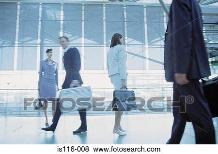 Businesspeople in airport terminal View Large Photo Image Stock Photo - Businesspeople in airport terminal. Fotosearch