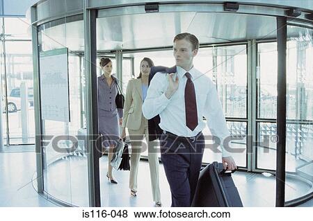 Businesspeople in airport terminal View Large Photo Image Stock Photo - Businesspeople in airport terminal. Fotosearch