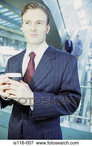Businesswoman checking airline ticket View Large Photo Image Stock Photo - Businesswoman checking airline ticket. Fotosearch