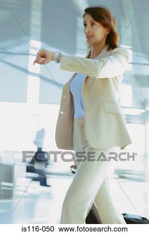 Businesswoman in airport terminal View Large Photo Image Stock Image - Businesswoman in airport terminal. Fotosearch
