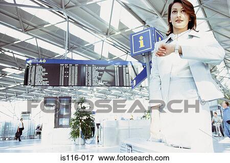 Stock Photo - Businesswoman waiting in airport terminal . Fotosearch