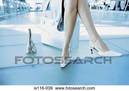 Businesswoman waiting in airport terminal View Large Photo Image Stock Photo - Businesswoman waiting in airport terminal. Fotosearch