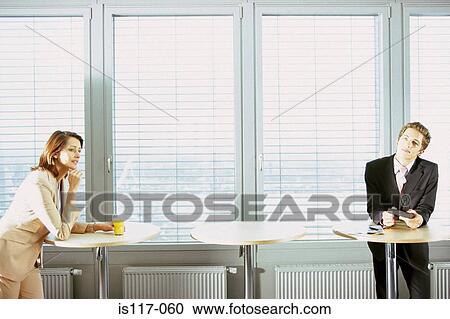 Businessman and businesswoman at office bar View Large Photo Image Stock Image - Businessman and businesswoman at office bar. Fotosearch