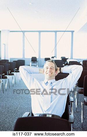 Businessman in conference hall View Large Photo Image Stock Photo - Businessman in conference hall. Fotosearch