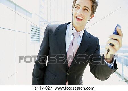 Businessman with cellphone View Large Photo Image Stock Photo - Businessman with cellphone. Fotosearch