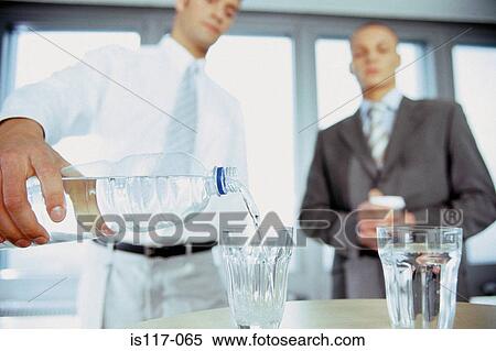 Businessmen having a drink View Large Photo Image Stock Photography - Businessmen having a drink. Fotosearch