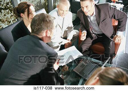 Stock Photo - Businesspeople in informal meeting. Fotosearch