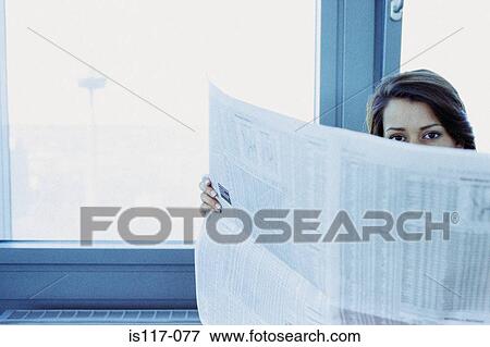 Businesswoman reading stocks and shares View Large Photo Image Stock Photo - Businesswoman reading stocks and shares. Fotosearch