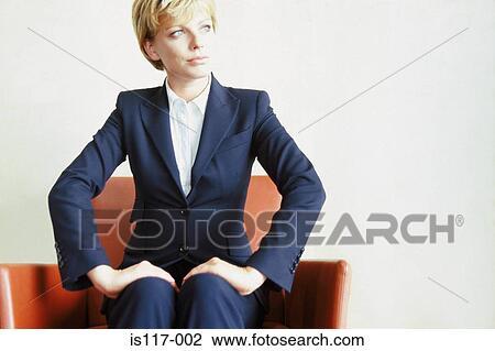 Businesswoman sitting on sofa View Large Photo Image Stock Image - Businesswoman sitting on sofa. Fotosearch