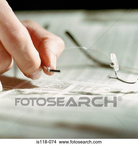 A hand holding a pair of spectacles View Large Photo Image Picture - A hand holding a pair of spectacles. Fotosearch