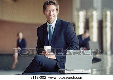 Businessman outside with laptop View Large Photo Image Stock Image - Businessman outside with laptop . Fotosearch