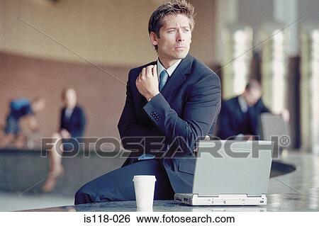 Stock Photograph - Businessman outside with laptop . Fotosearch
