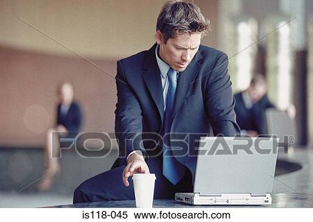 Businessman outside with laptop View Large Photo Image Stock Photography - Businessman outside with laptop . Fotosearch