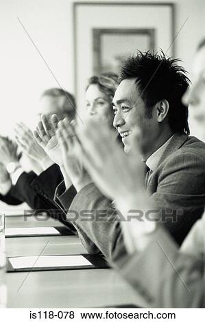 Businesspeople applauding in meeting View Large Photo Image Stock Photo - Businesspeople applauding in meeting. Fotosearch