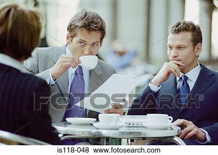 Businesspeople having meeting at cafe View Large Photo Image Stock Photo - Businesspeople having meeting at cafe. Fotosearch