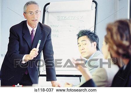 Businesspeople in meeting View Large Photo Image Stock Photo - Businesspeople in meeting. Fotosearch