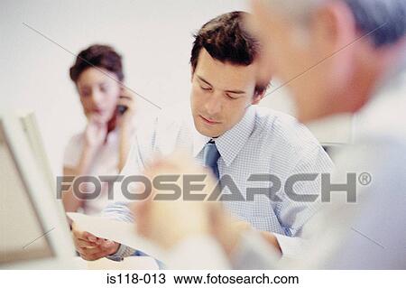 Stock Image - Businesspeople in office. Fotosearch