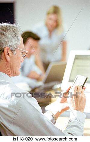 Businesspeople in office View Large Photo Image Stock Image - Businesspeople in office. Fotosearch