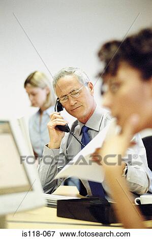 Stock Photo - Businesspeople in office. Fotosearch