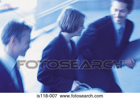 Businesspeople walking briskly View Large Photo Image Stock Photo - Businesspeople walking briskly. Fotosearch