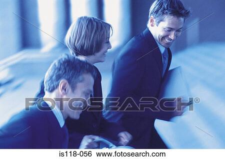 Stock Photograph - Businesspeople walking briskly. Fotosearch
