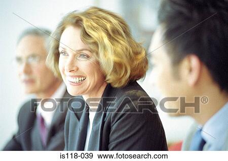 Businesswoman talking in meeting View Large Photo Image Stock Photo - Businesswoman talking in meeting. Fotosearch